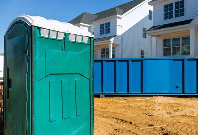 all lined up, these porta potties provide easy access for work site workers